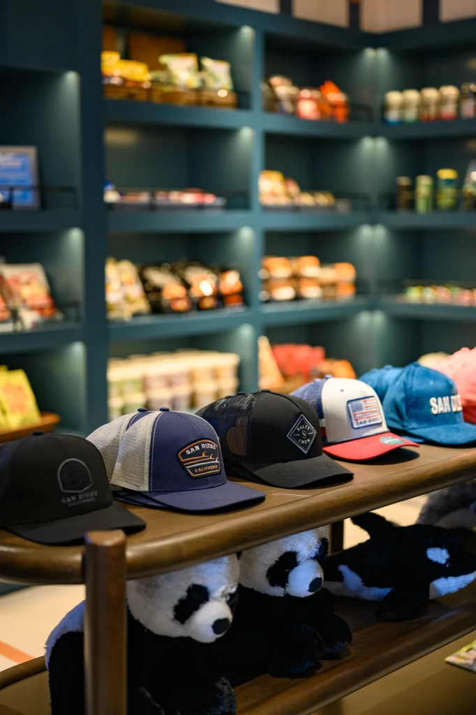 High-end retail product photography featuring a hat stand with a blurred fashion backdrop for a boutique brand.