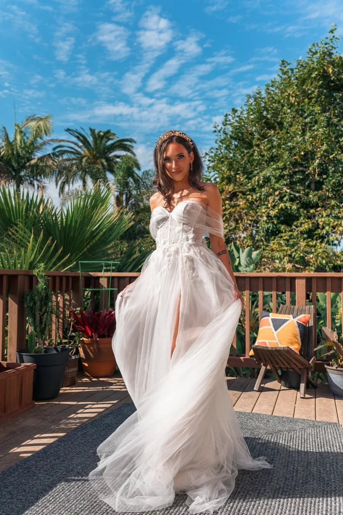 A motion-filled shot of a bride spinning in her dress, showcasing the movement and elegance of the wedding day.