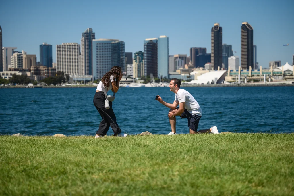 Cinematic proposal photography at an iconic Coronado location, capturing a surprise engagement in San Diego.