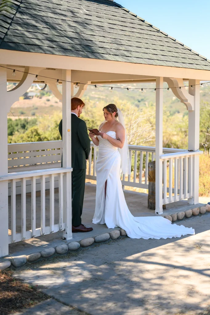 An intimate, shot of a bride and groom exchanging vows during a cinematic wedding ceremony.