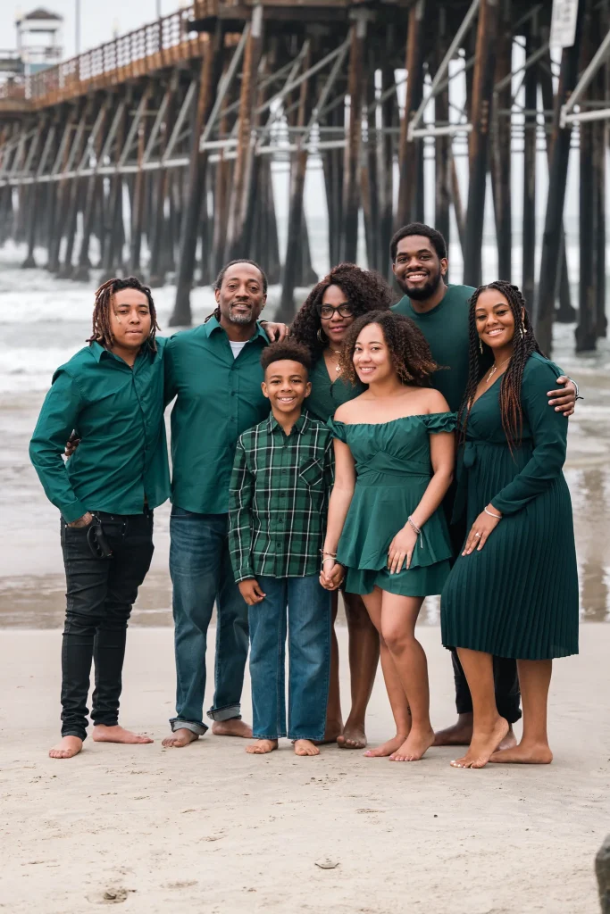 Professional group photography in Oceanside, capturing a candid moment near the coast by Noah Gilman Productions.