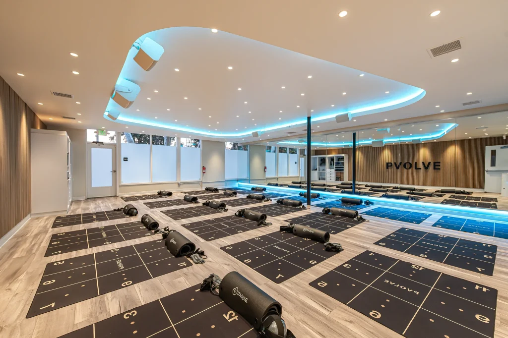 Wide-angle architectural photo of an empty modern fitness studio in Carlsbad.
